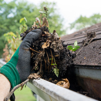 Regular gutter maintenance can prevent clogging with dirt and leaves as shown in this photo